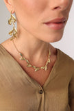Demi Selia Necklace on model — handmade brass olive branch necklace with enamel leaves and fruit on chain