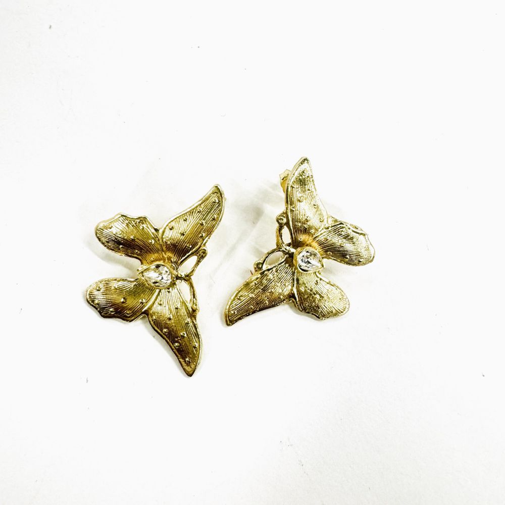 handmade brass butterfly earrings with clear crystal center stone, flat lay pair view