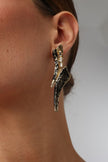 Sparkly Nerra Earring — handmade brass twisted sculptural earrings with baguette crystals, oxidized finish on model close-up