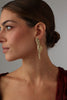 Sparkly Nerra Earring — handmade brass sculptural drop earrings with baguette crystals on model, polished finish