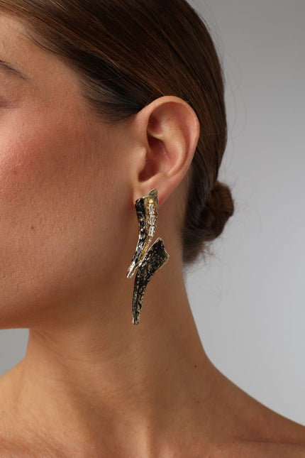  Sparkly Nerra Earring — handmade brass long sculptural drop earrings with crystals and oxidized finish on model