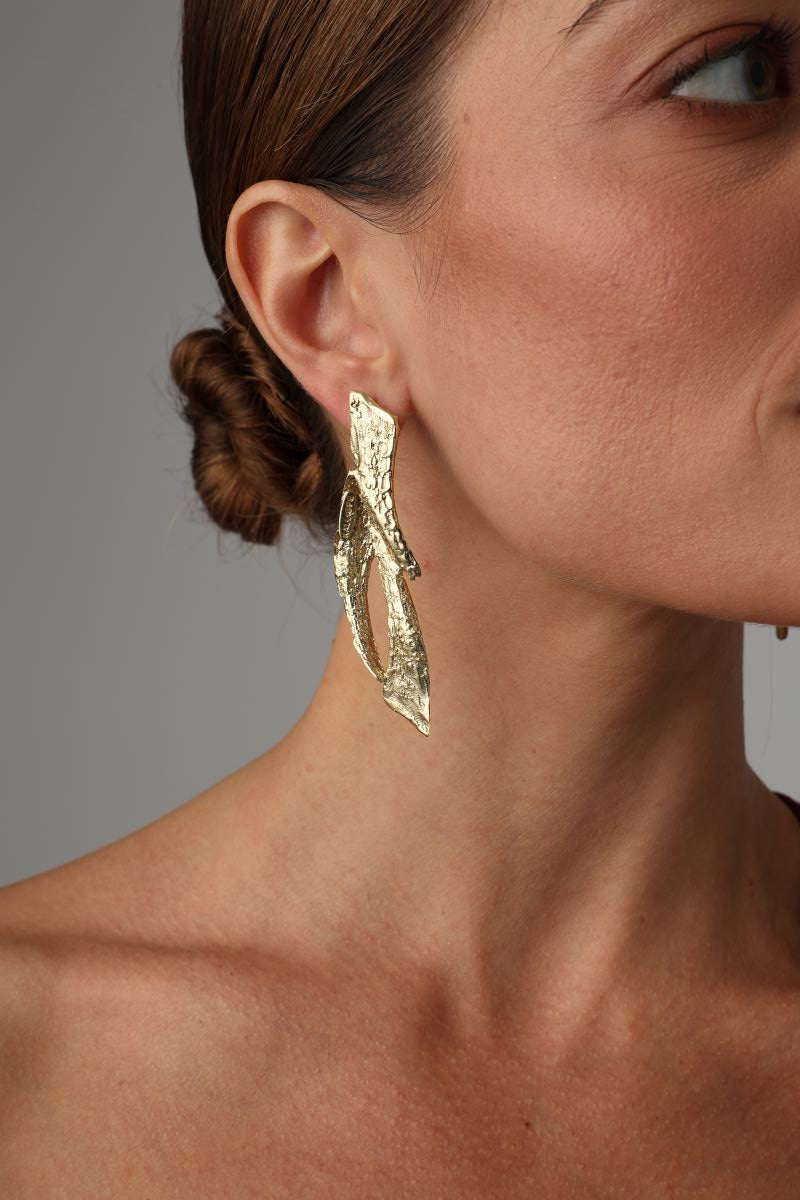  Nerra Earring — handmade brass long sculptural drop earrings with organic twisted form on model
