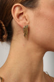  Dragonfish Earring — handmade brass raw textured stud earrings polished finish on model, artisan jewelry