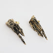 Dragonfish Earring — handmade brass sculptural stud earrings with oxidized finish, flat lay close-up