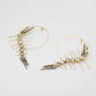 handmade brass sculptural hoop earrings with crystal creature form, artisan jewelry made in Greece