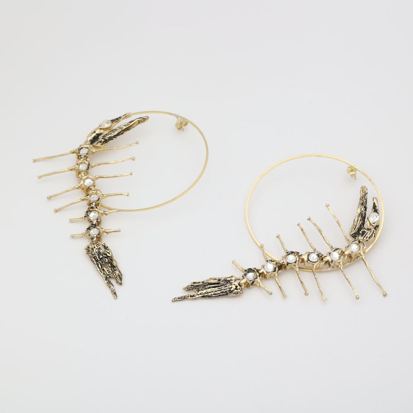 handmade brass sculptural hoop earrings with crystal creature form, artisan jewelry made in Greece