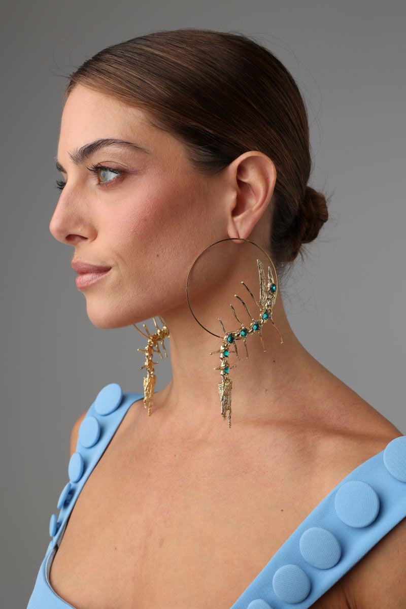 Draco Earring — handmade brass sculptural hoop earrings with crystal creature form on model, full view