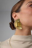 Pond Earring — handmade brass oversized half-moon stud earrings with raw gemstone on model, close-up
