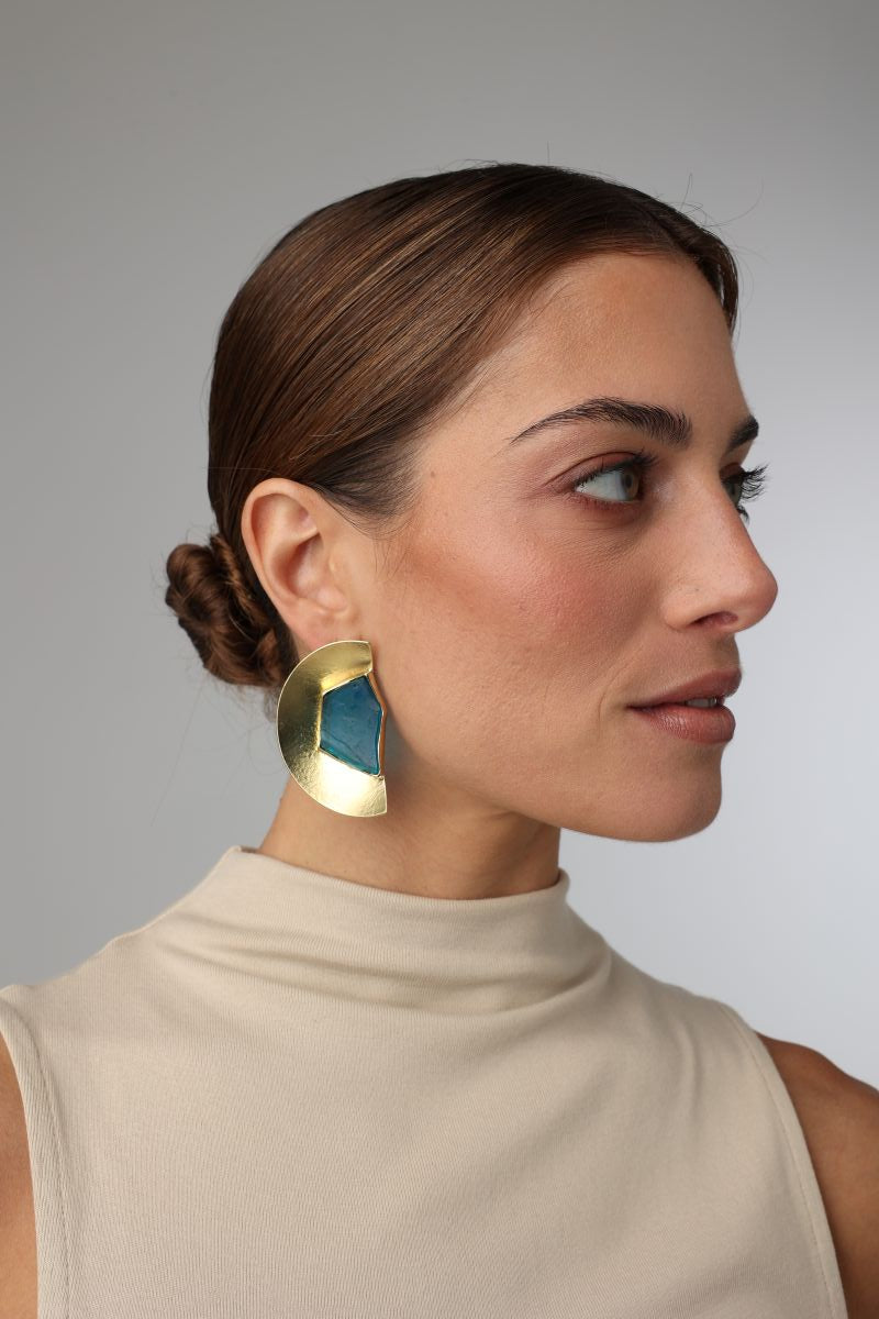 Pond Earring — handmade brass half-moon statement earrings with raw gemstone on model, side profile