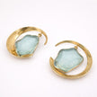  Lucky Lake Earring — handmade brass oversized hoop earrings with raw aquamarine stone, flat lay