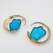 Lucky Lake Earring — handmade brass statement hoop earrings with raw blue gemstone, flat lay