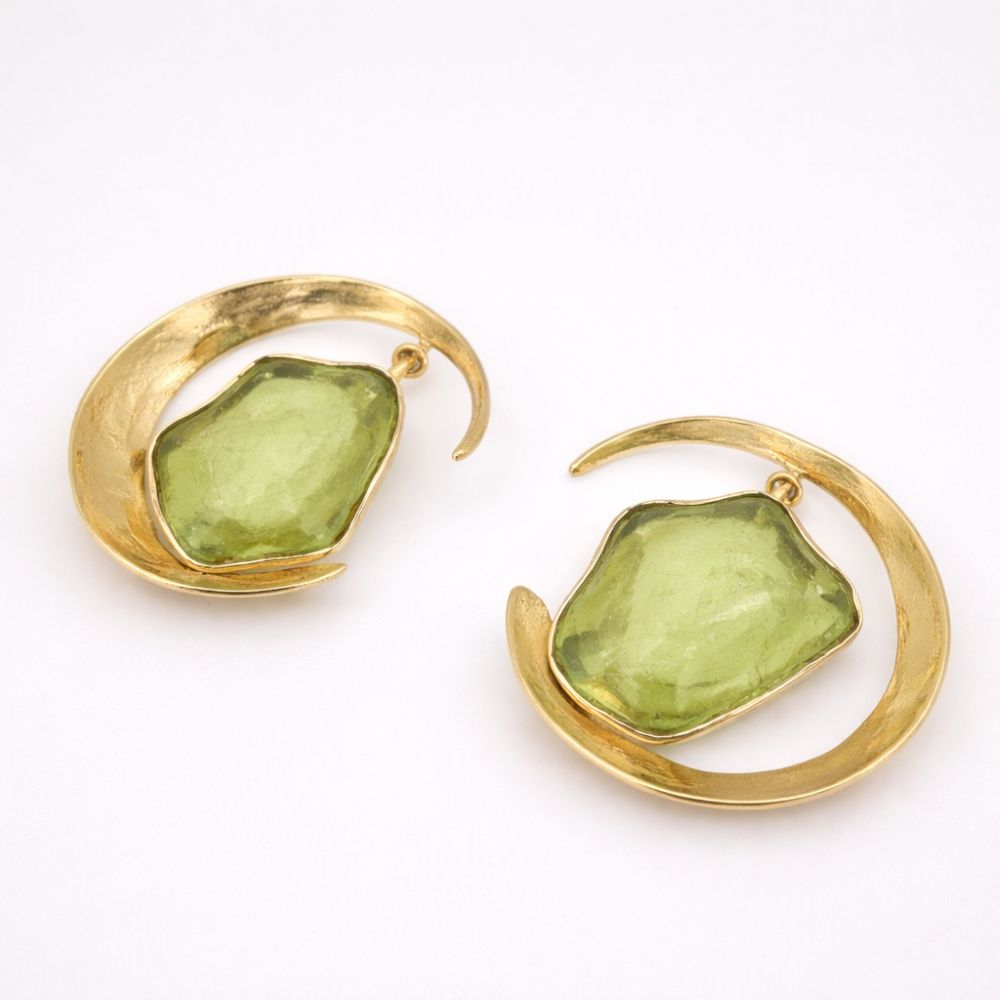 Lucky Lake Earring — handmade brass crescent hoop earrings with raw peridot stone, flat lay