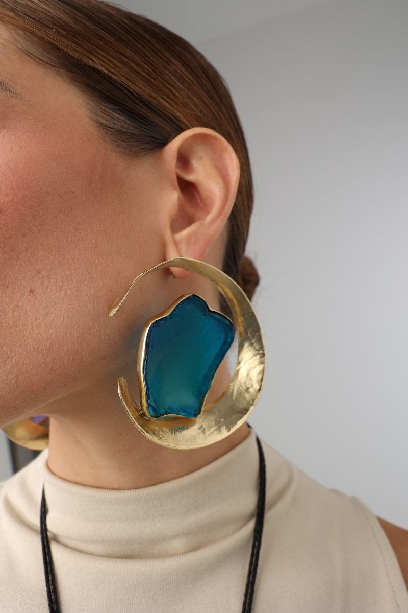 Lucky Lake Earring — handmade brass large crescent hoop earrings with raw gemstone on model, statement artisan jewelry