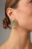 Crabby Earring — handmade brass oversized crab stud earrings with aqua stone on model