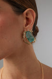 Crabby Earring — handmade brass crab stud earrings with sea glass stone body on model
