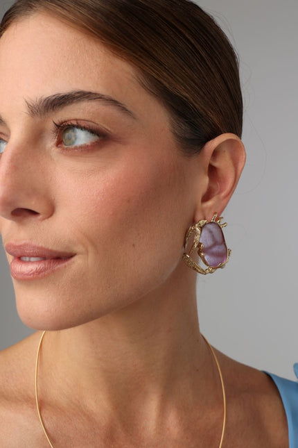 Crabby Earring — handmade brass crab stud earrings with gemstone body on model, artisan jewelry made in Greece