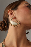 Claw Crabby Earring — handmade brass oversized crab statement earrings with white stone shell on model