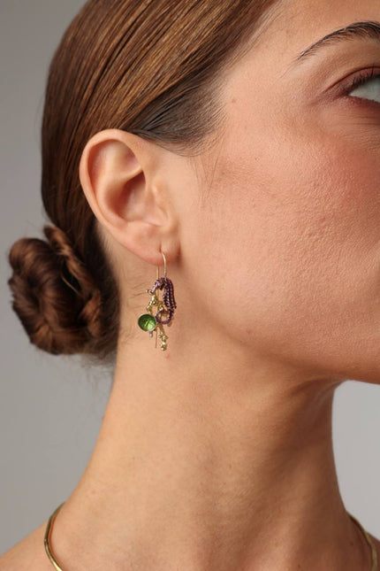 Coralia Earring — handmade brass seahorse drop earrings with enamel and shell charm on model