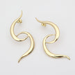  handmade brass open swirl statement earrings, flat lay pair view, artisan jewelry made in Greece