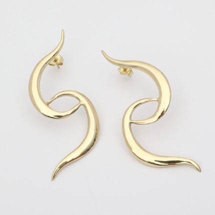  handmade brass open swirl statement earrings, flat lay pair view, artisan jewelry made in Greece