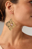 filigree handmade gold-plated drop earrings with pink crystal on model