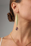 long gold-plated earrings with pink crystal on model