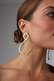 Pair of handmade brushed bronze earrings with abstract organic shapes on a white background.