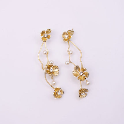 Brass cascading floral drop earrings pair with pearl detail, product shot