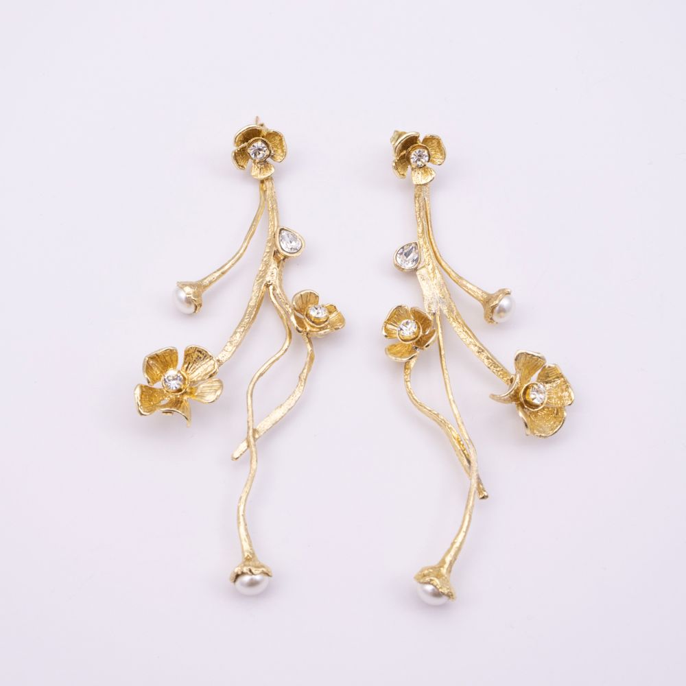 Brass long drop earrings pair with clear crystal flowers and pearl buds, product shot