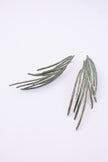 Double Pine Earrings close-up, handmade brass earrings with fine grooved feather texture and bright varnished finish