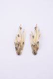 Peacock Earrings side view, handmade brass sculptural earrings with hammered bird body and layered feather plumage
