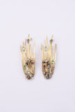 Peacock Earrings angle view, handmade brass sculptural drop earrings with peacock silhouette and open design
