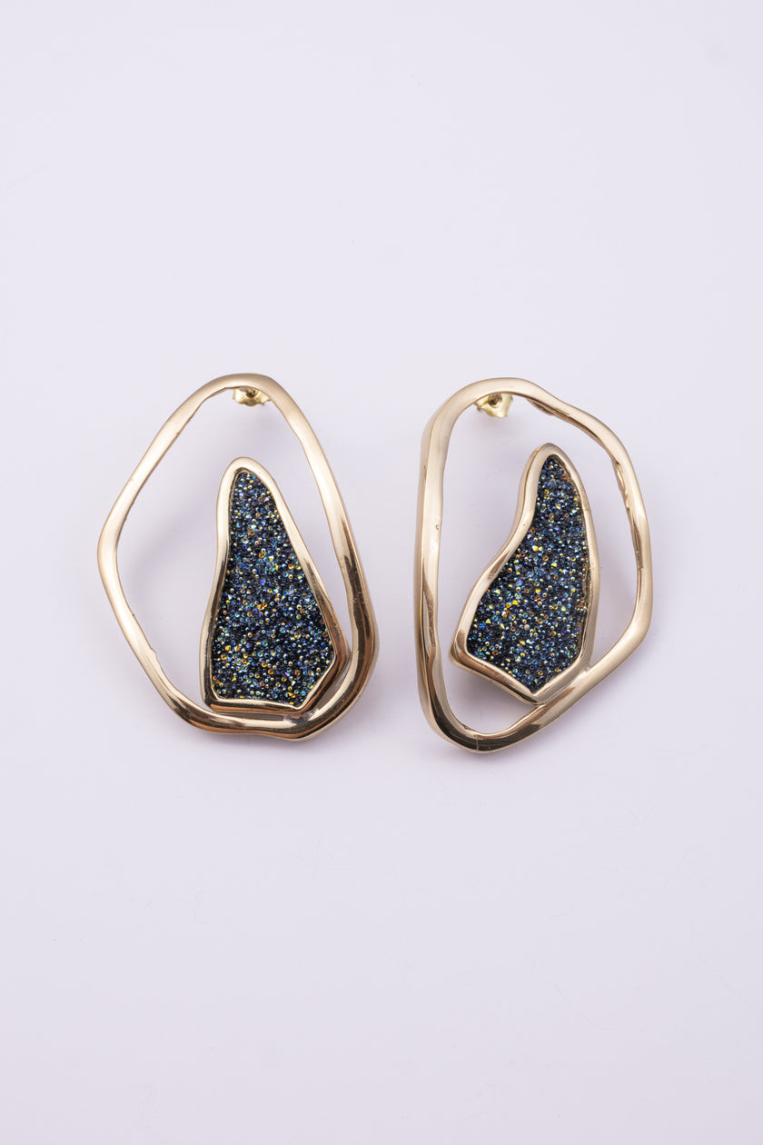 Shimmer Earrings close up: handmade brass earrings with tiny faceted crystals set in a sculpted bezel