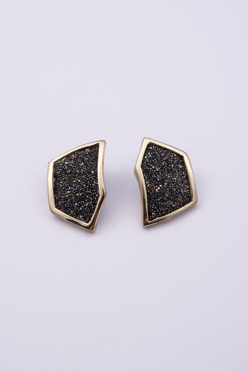 Sparkle Earrings close up: handmade brass earrings with tiny faceted crystals set in a sleek brass frame