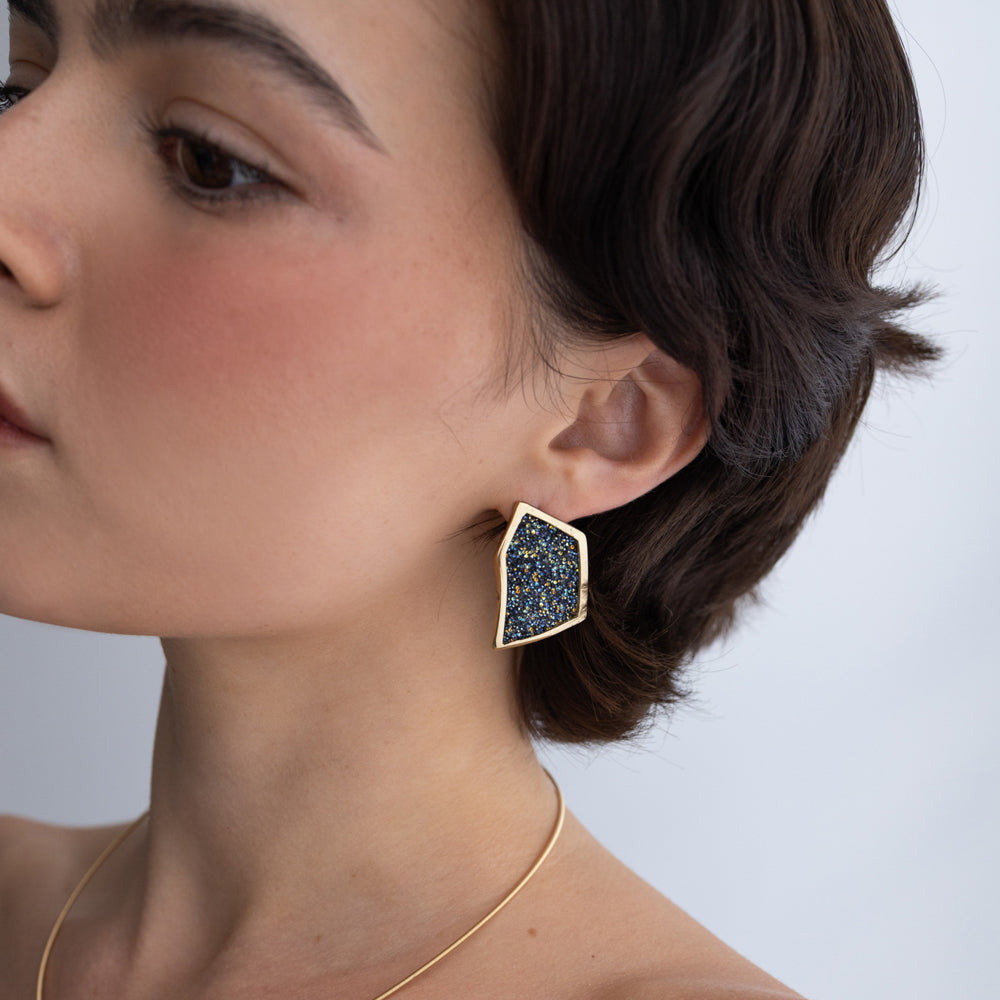 Sparkle Earrings on model: handmade brass statement earrings worn on ear showing scale and proportion