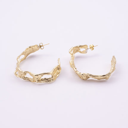 Lichen Hoop Earrings angle view, handmade brass sculptural hoop earrings with tangled lace like band and irregular openings
