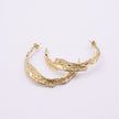 Willow Hoop Earrings close up, handmade brass earrings with molten bark texture and post fastening