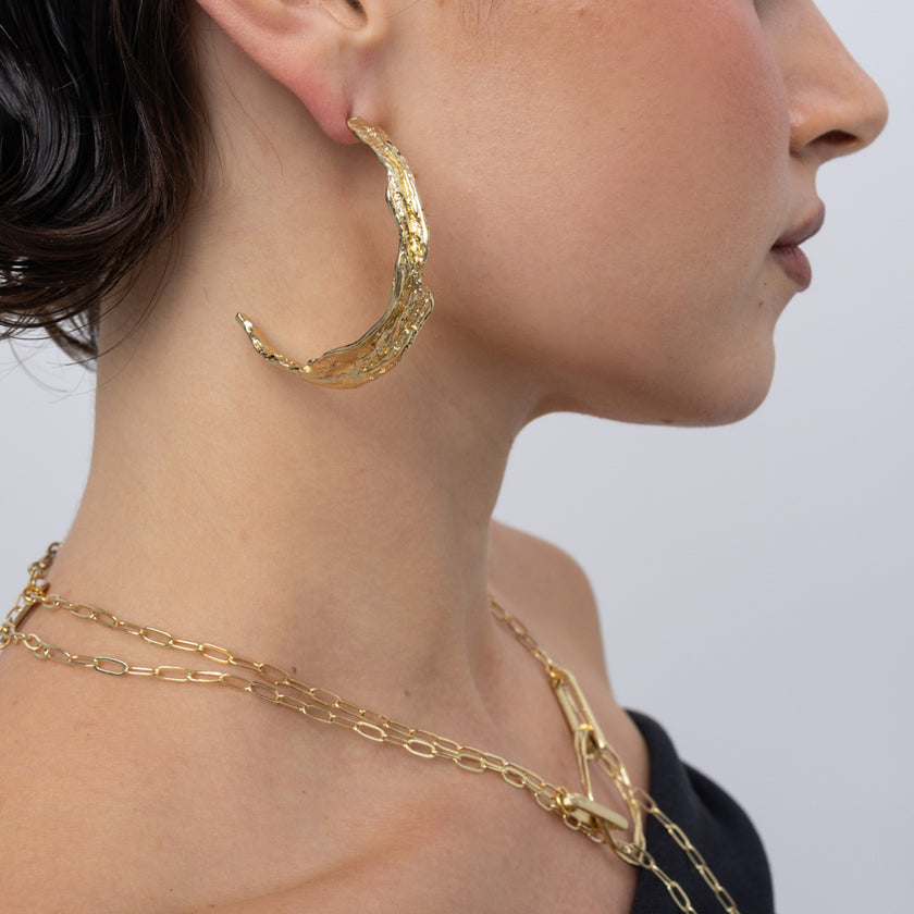 Willow Hoop Earrings on model, handmade brass hoop earrings worn on ear showing scale and branch like texture