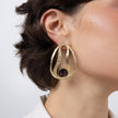 Boteh Earrings on model, handmade brass teardrop statement earrings worn on ear showing scale and crystal centerpiece