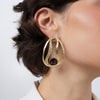 Boteh Earrings on model, handmade brass teardrop statement earrings worn on ear showing scale and crystal centerpiece