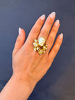 Aurea Ring close-up — handmade brass sculptural ring with baroque pearl, small pearls and crystal embellishments
