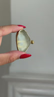 Elemental Pebble Ring detail — handmade brass open band ring with raw resin stone setting